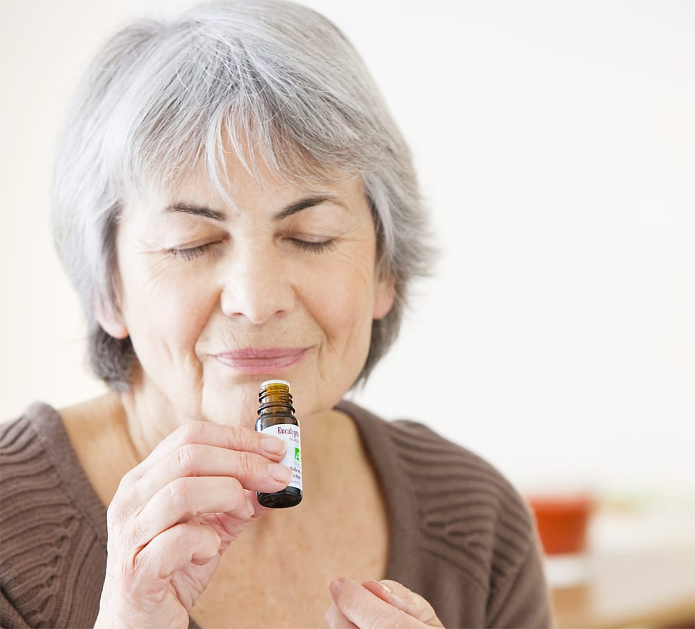 aromatherapy in senior living, aromatherapy, essential oils, older woman smelling essential oil