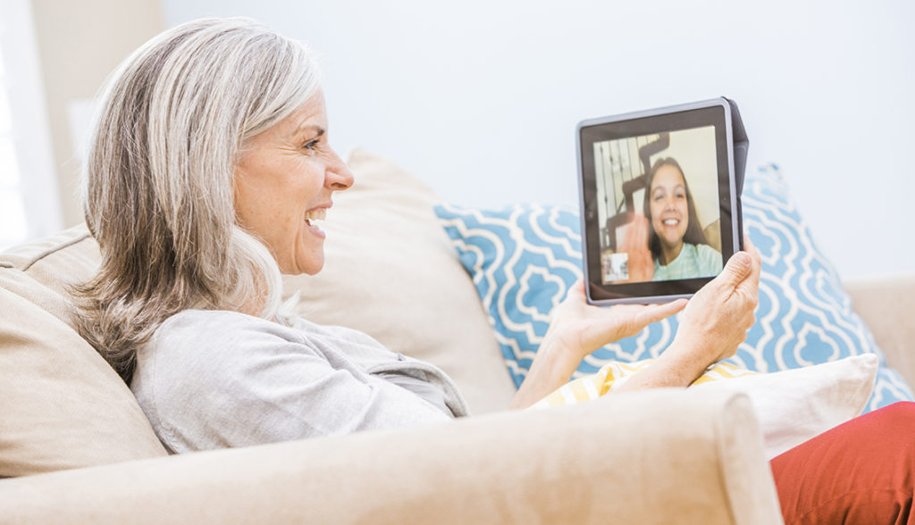 Isolation in senior living, coronavirus, senior woman video chatting